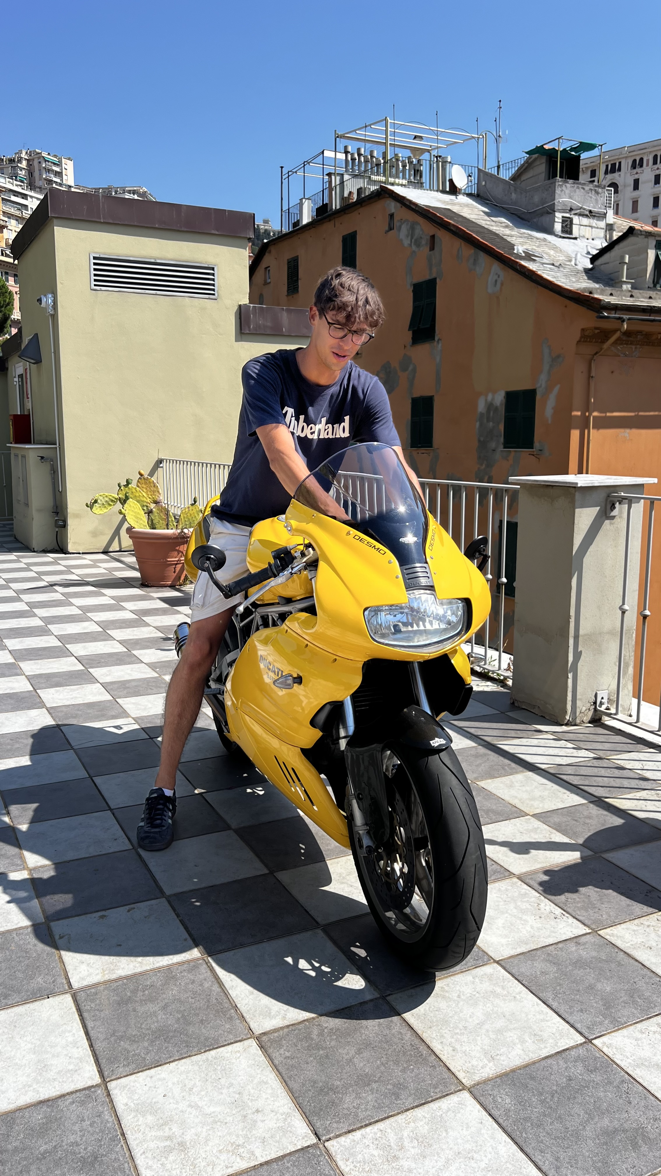 Alex sitting on a yellow Ducati 750 SS