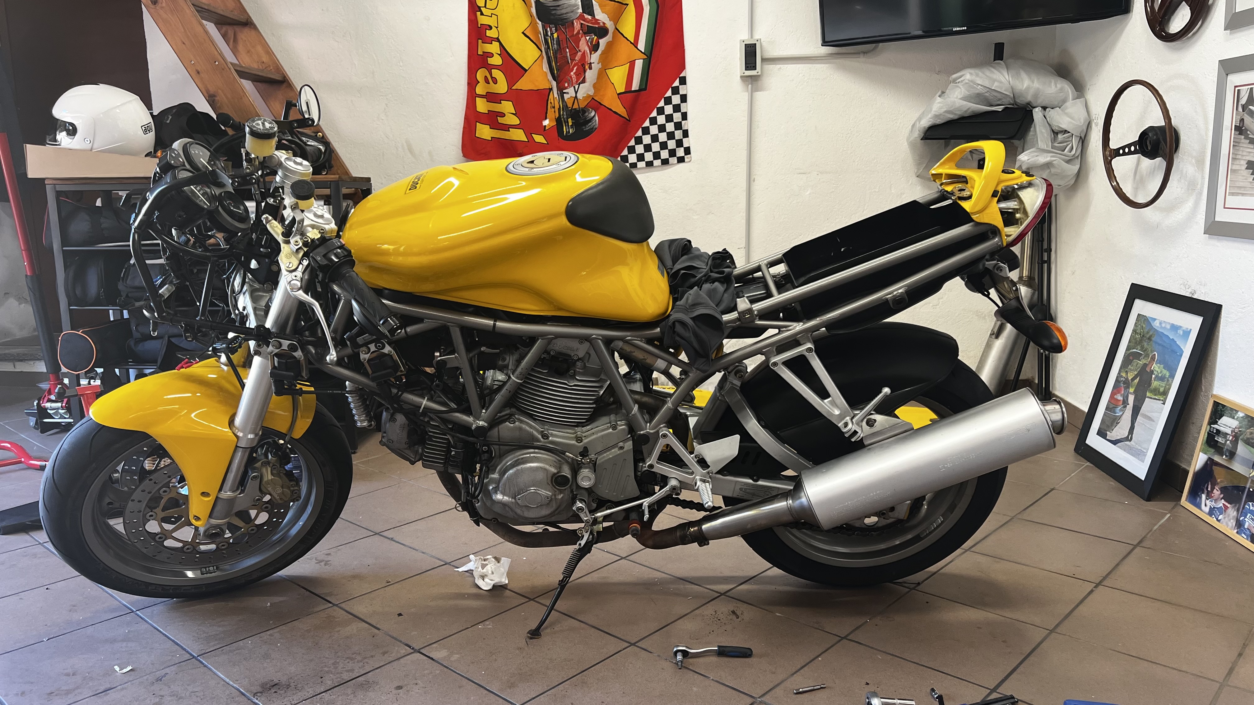 Yellow Ducati 750 SS project bike in the garage