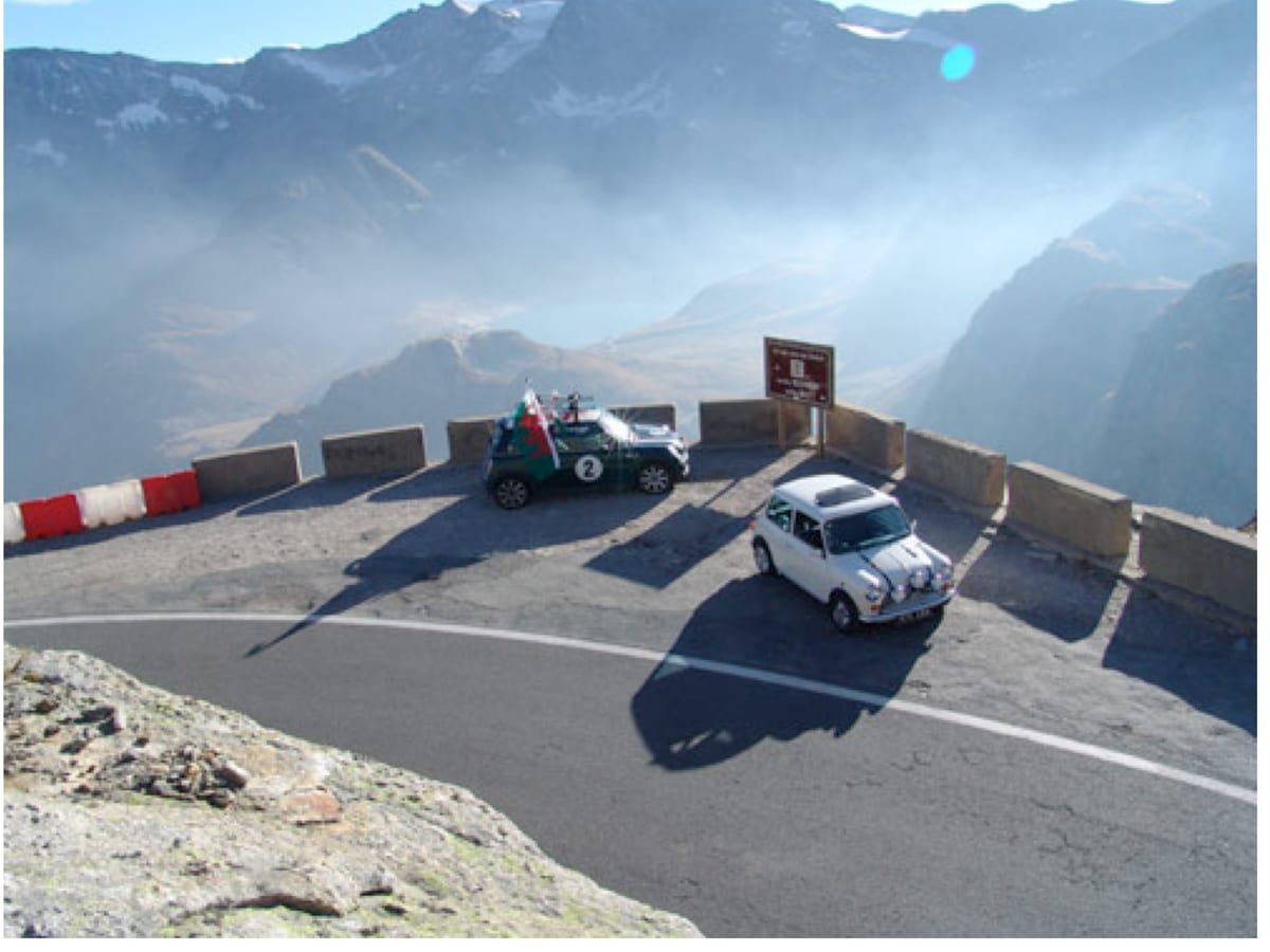 A classic Mini on the mountain road at Colle del Nivolet above Ceresole Reale, location of The Italian Job coach cliffhanger