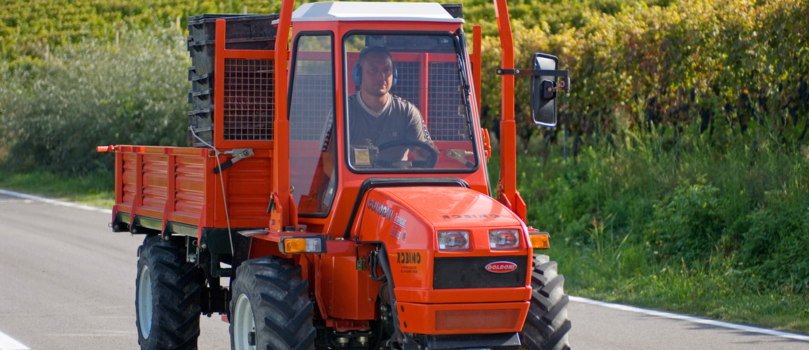 Red tractor of wine producer